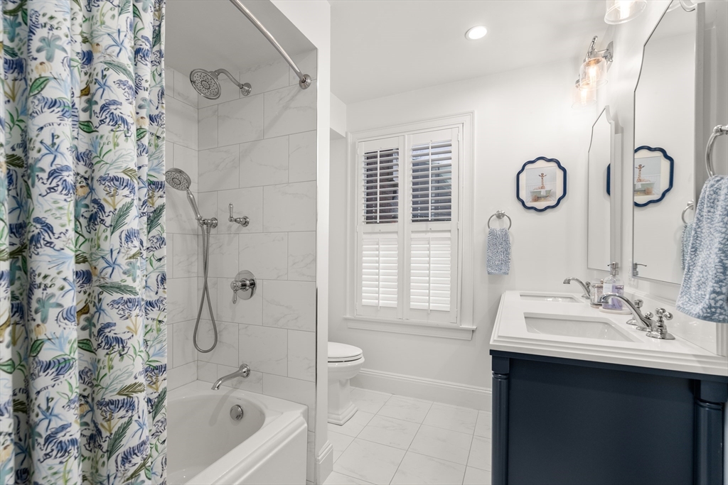 19 Charles Street Boston, MA 02129 - Photo 19 of 28 a bathroom with a sink toilet and shower