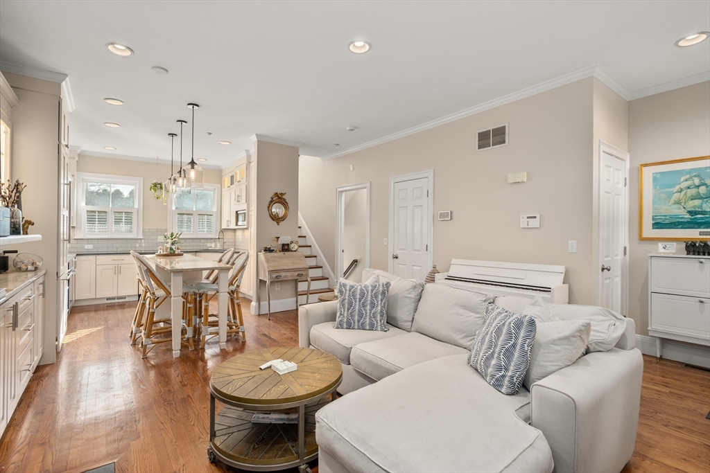 19 Charles Street Boston, MA 02129 - Photo 7 of 28 a living room with furniture a sink and a chandelier
