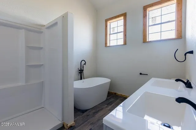 a spacious bathroom with a bathtub and window