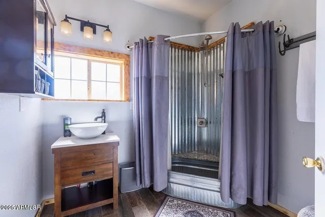 a bathroom with a sink a vanity and a mirror