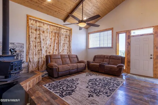 a living room with furniture and a rug