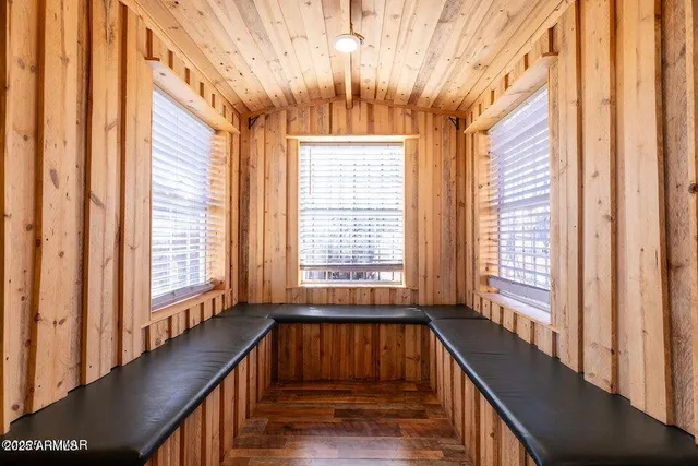a view of entryway with wooden floor and stairs