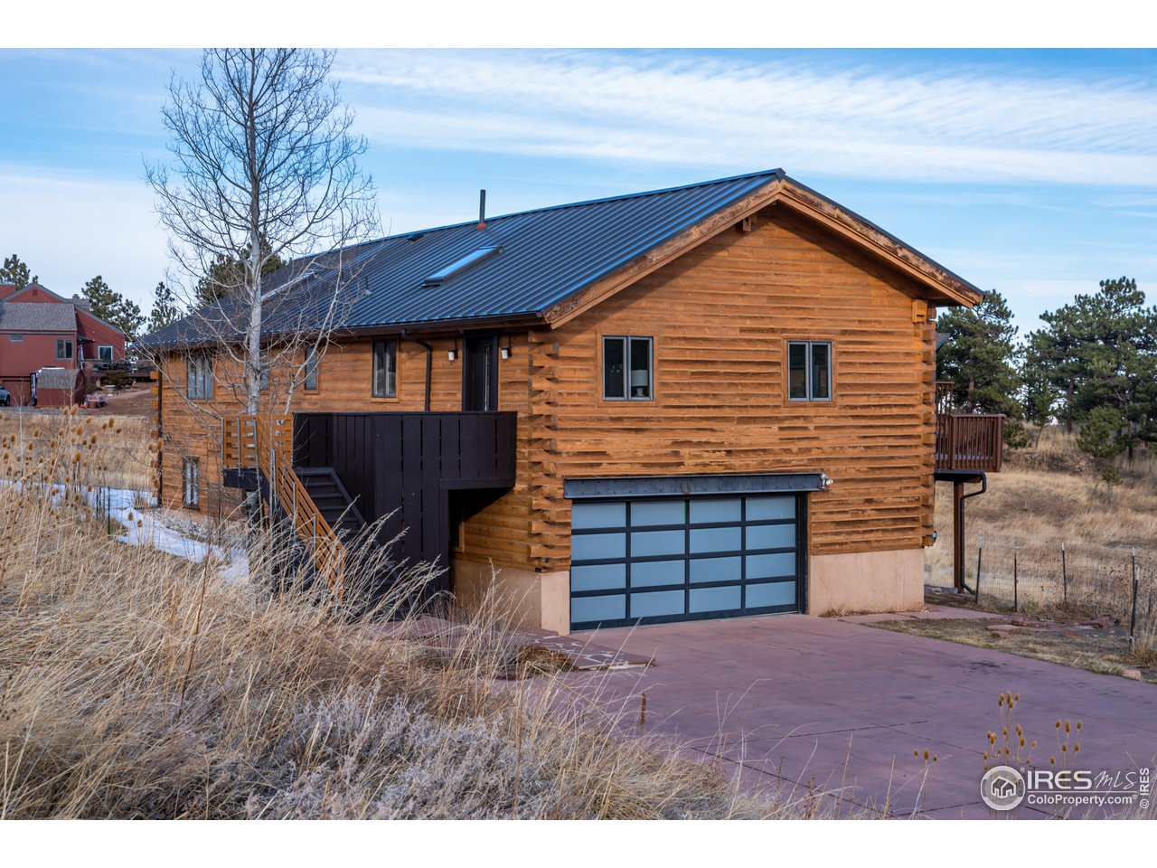 8324 West Fork Road Boulder, CO 80302 - Photo 1 of 38 a front view of a house with a yard