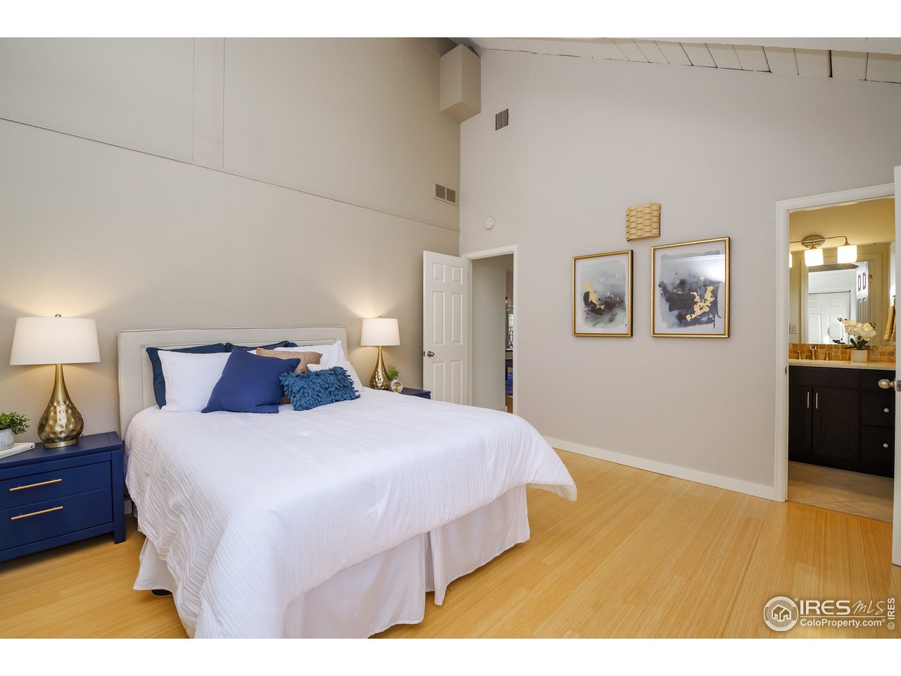 8324 West Fork Road Boulder, CO 80302 - Photo 16 of 38 a bedroom with a bed and wooden floor