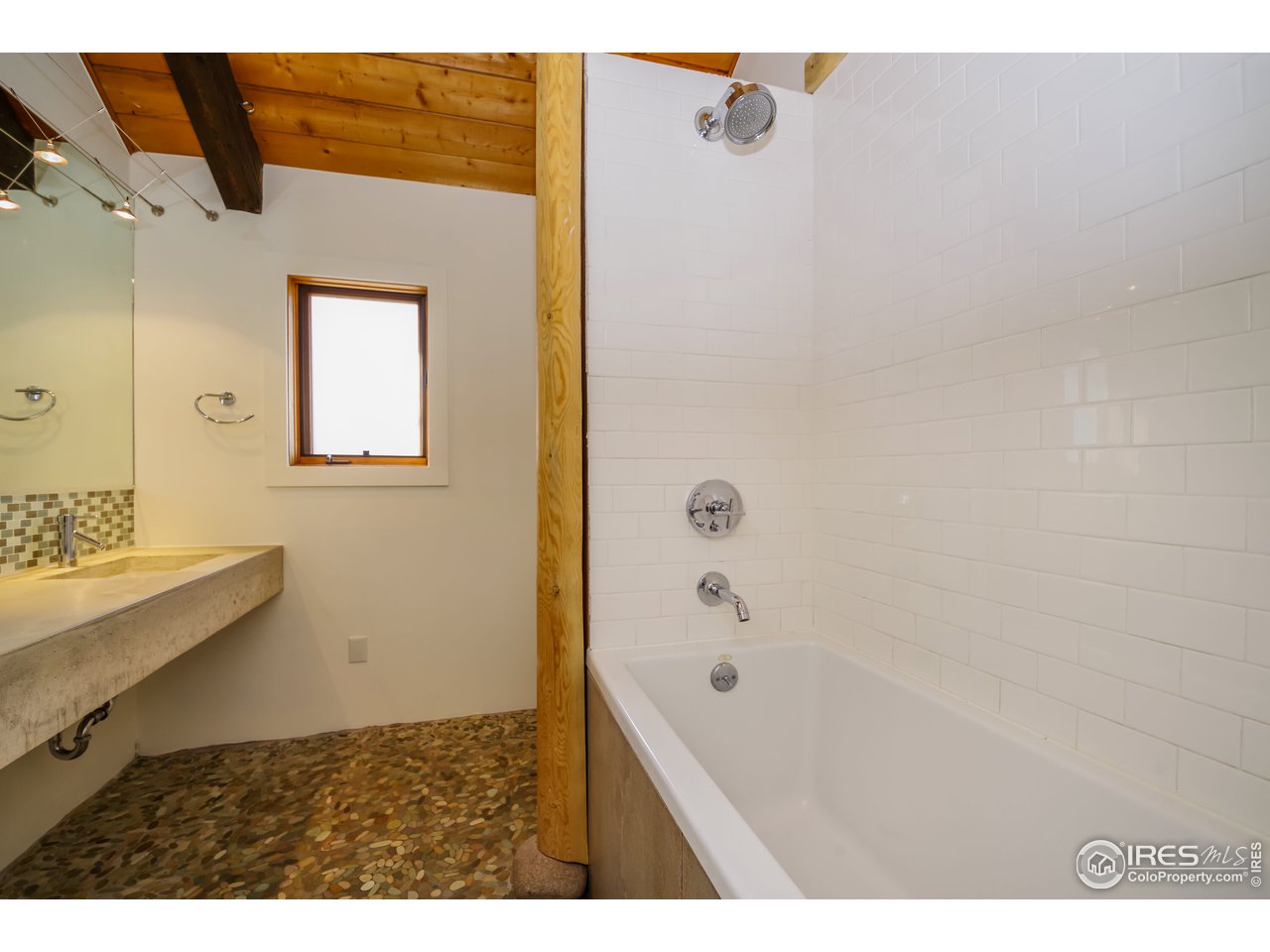 8324 West Fork Road Boulder, CO 80302 - Photo 21 of 38 a bathroom with a bathtub and a sink
