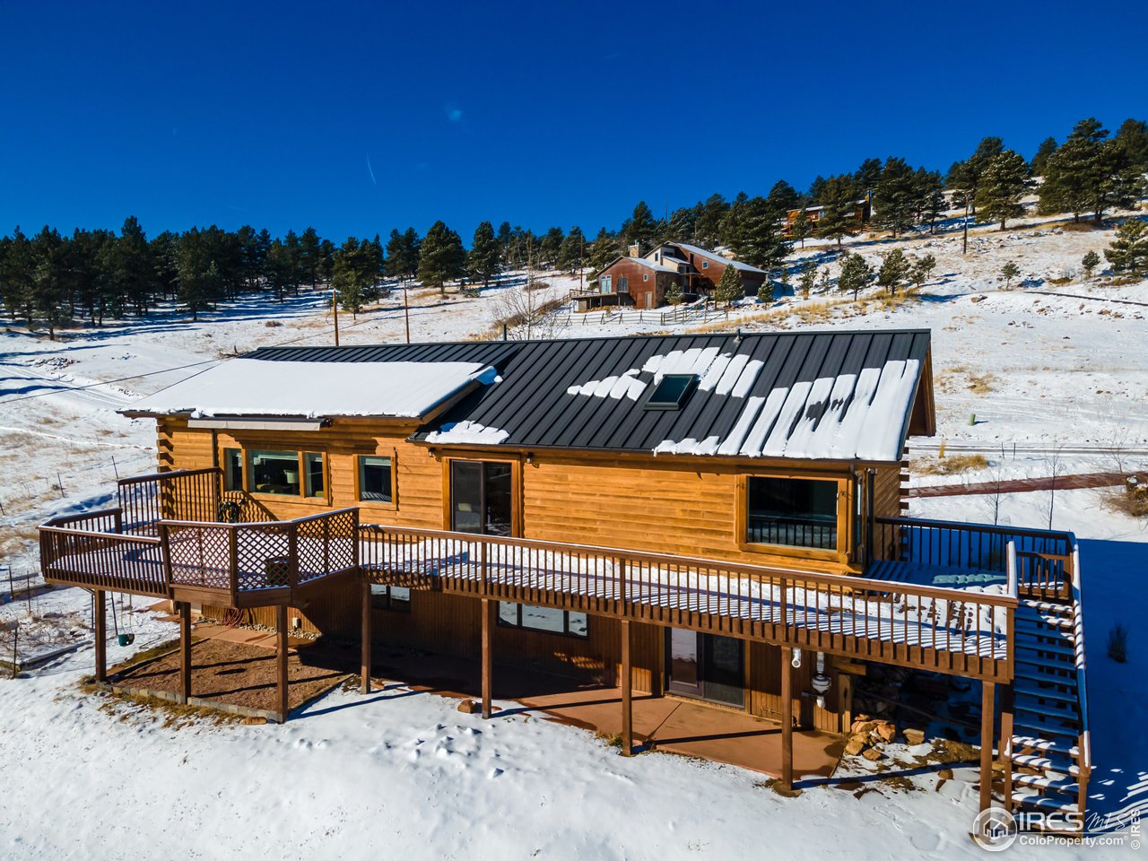 8324 West Fork Road Boulder, CO 80302 - Photo 4 of 38 a view of a chairs and table in the terrace