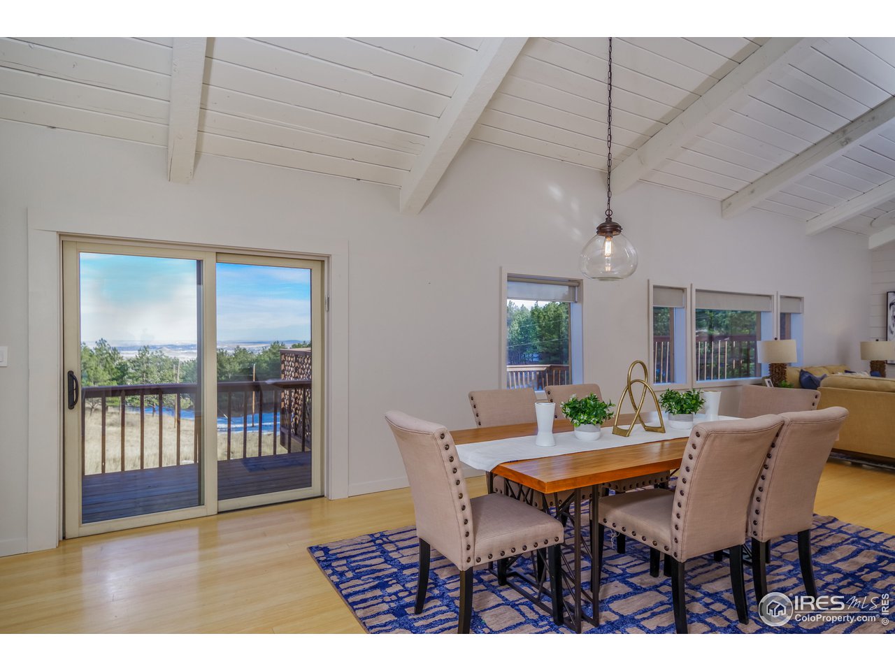 8324 West Fork Road Boulder, CO 80302 - Photo 9 of 38 a view of a dining room with furniture window and outside view