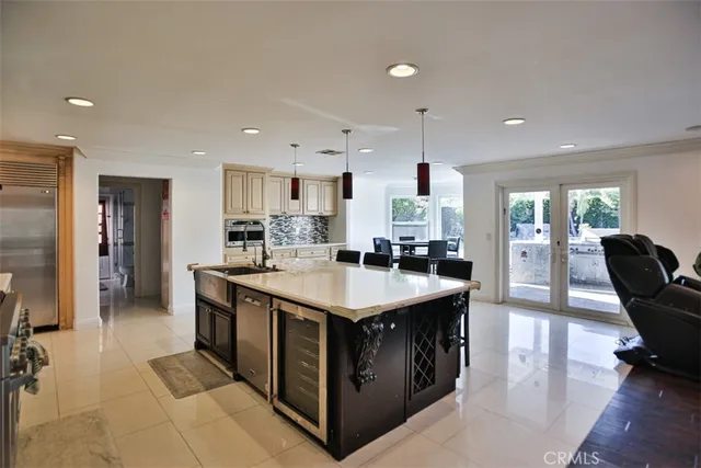 a kitchen with a stove and a refrigerator