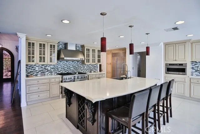 a kitchen with a table and chairs in it