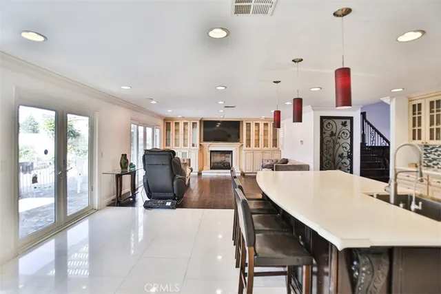 a living room with fireplace furniture and a flat screen tv