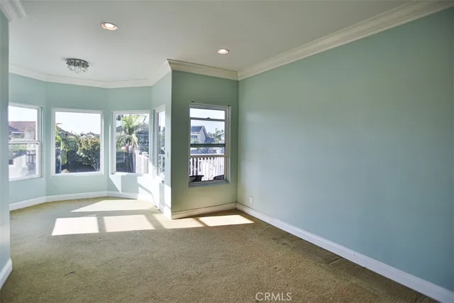 a view of a big room with windows and cabinet