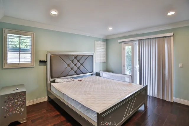 a room with a bed and furniture