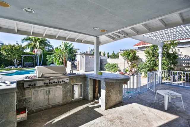 a view of a house with entertaining space and a yard