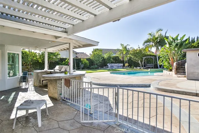 a front view of a house with garden and porch