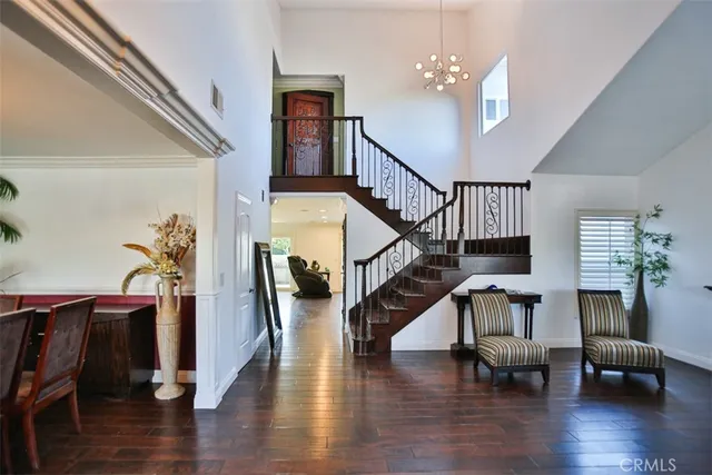 a view of entryway livingroom and hall with wooden floor