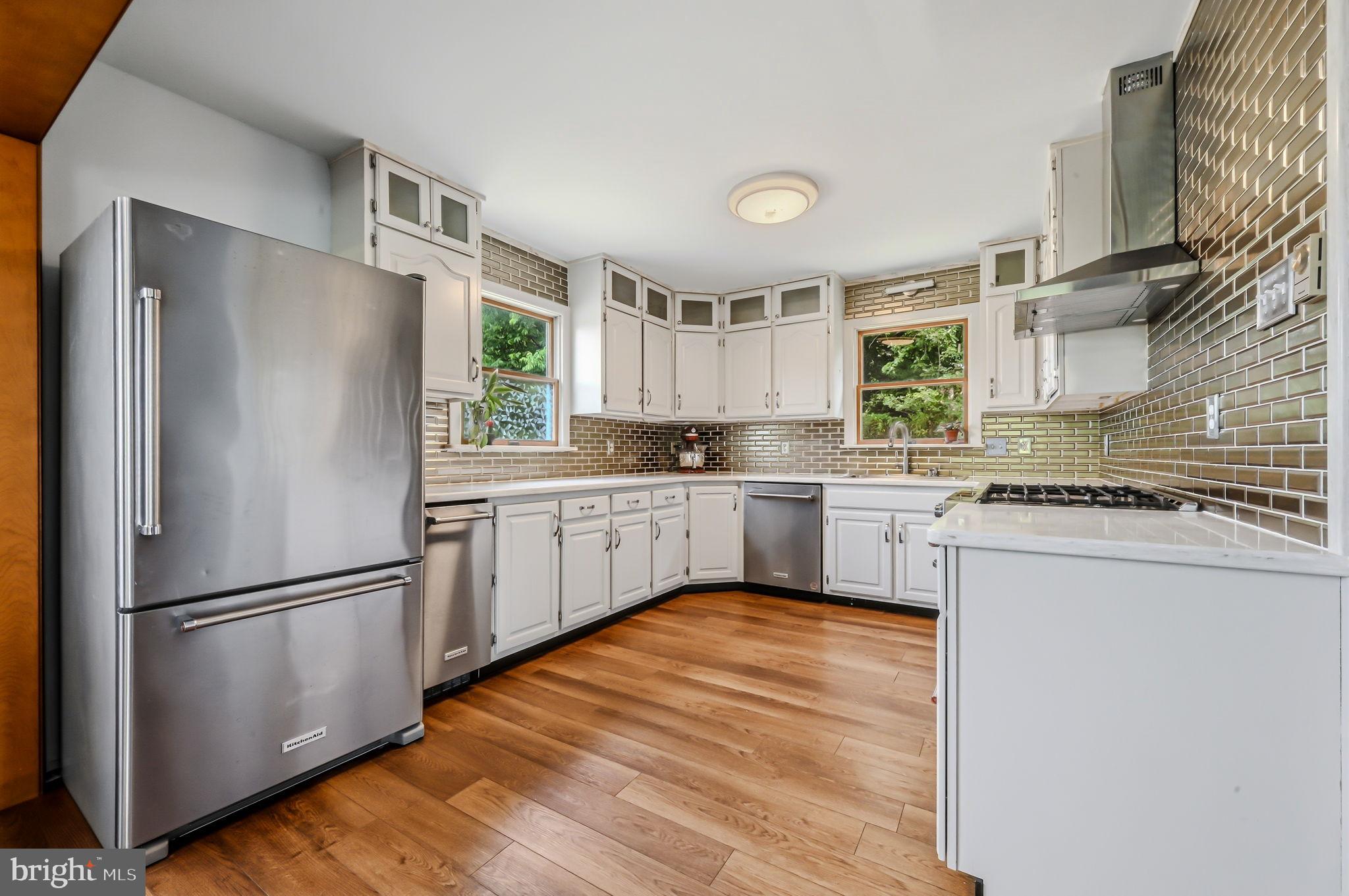 210 Elk View Road North East, MD 21901 - Photo 13 of 64 a kitchen with a refrigerator a sink and cabinets
