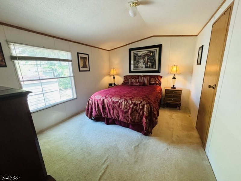 35 Roberts Road Toms River, NJ 08755 - Photo 11 of 17 a spacious bedroom with a bed and a window