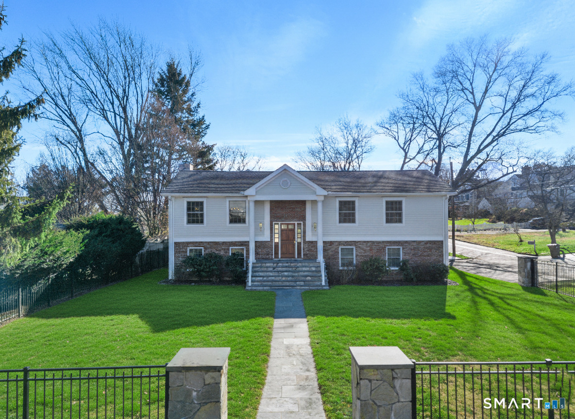 front view of a house with a yard