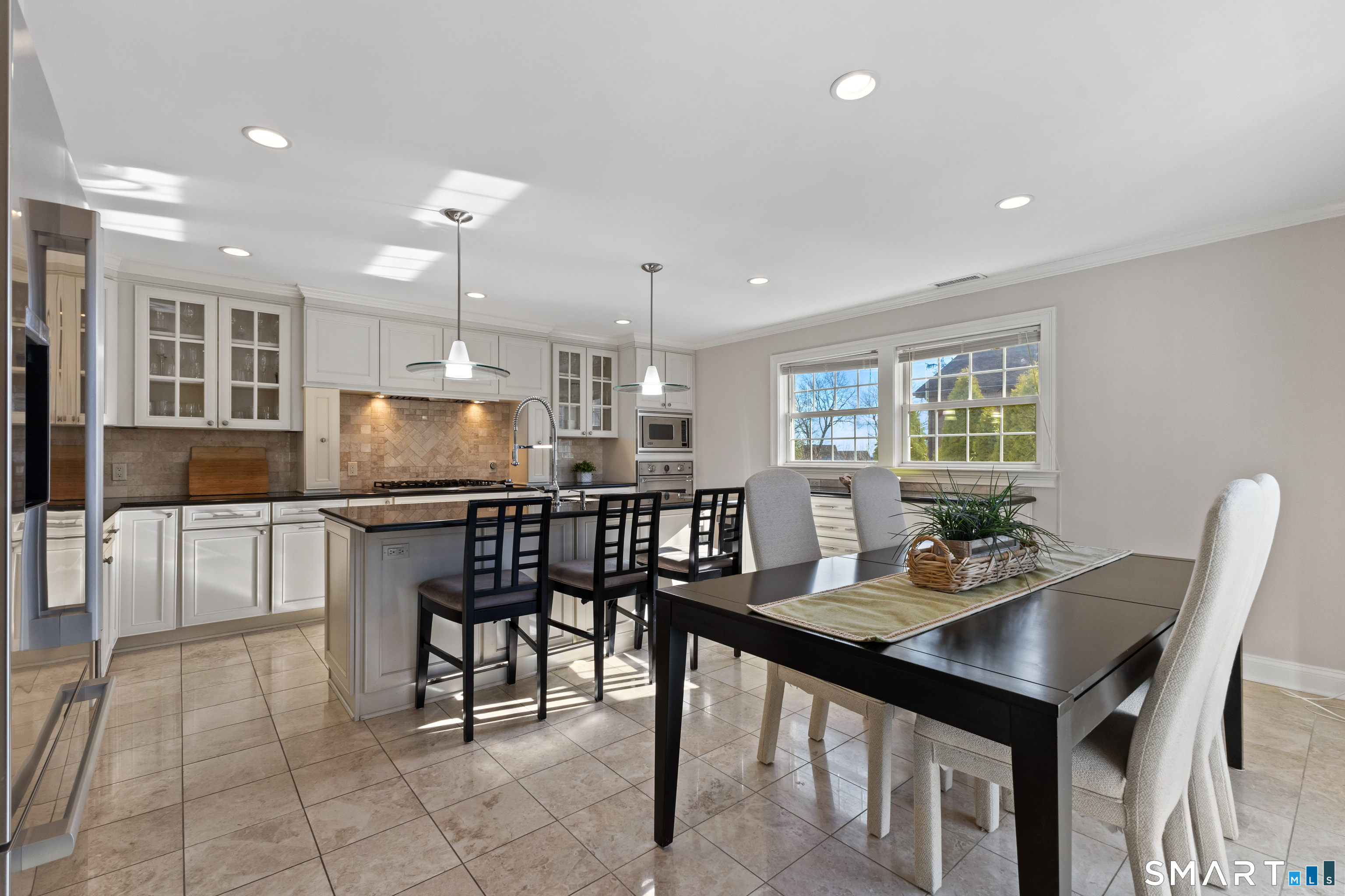61 Hobson Street Stamford, CT 06902 - Photo 15 of 36 a kitchen with a dining table chairs and view kitchen