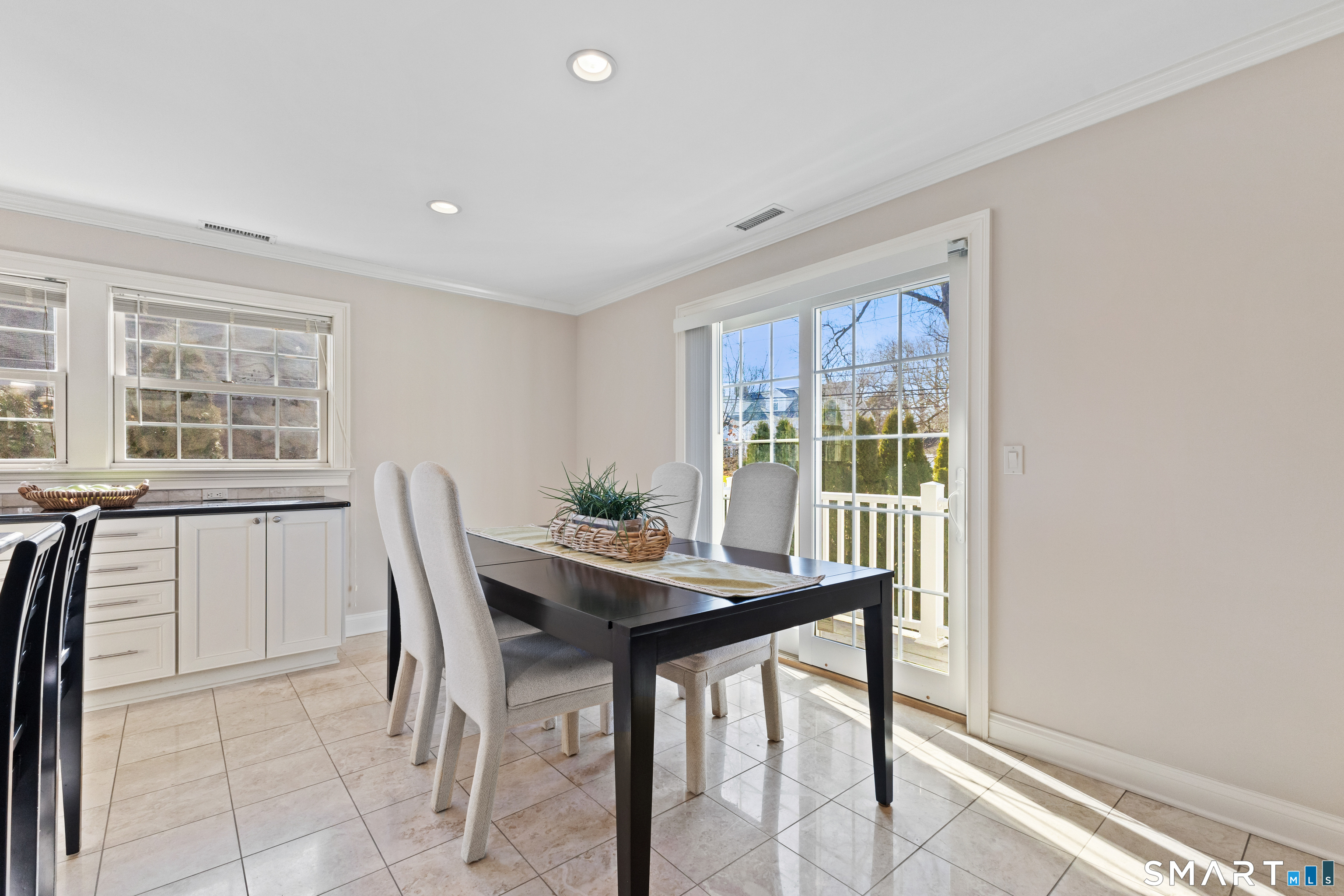 61 Hobson Street Stamford, CT 06902 - Photo 16 of 36 a view of a dining room with furniture window and outside view