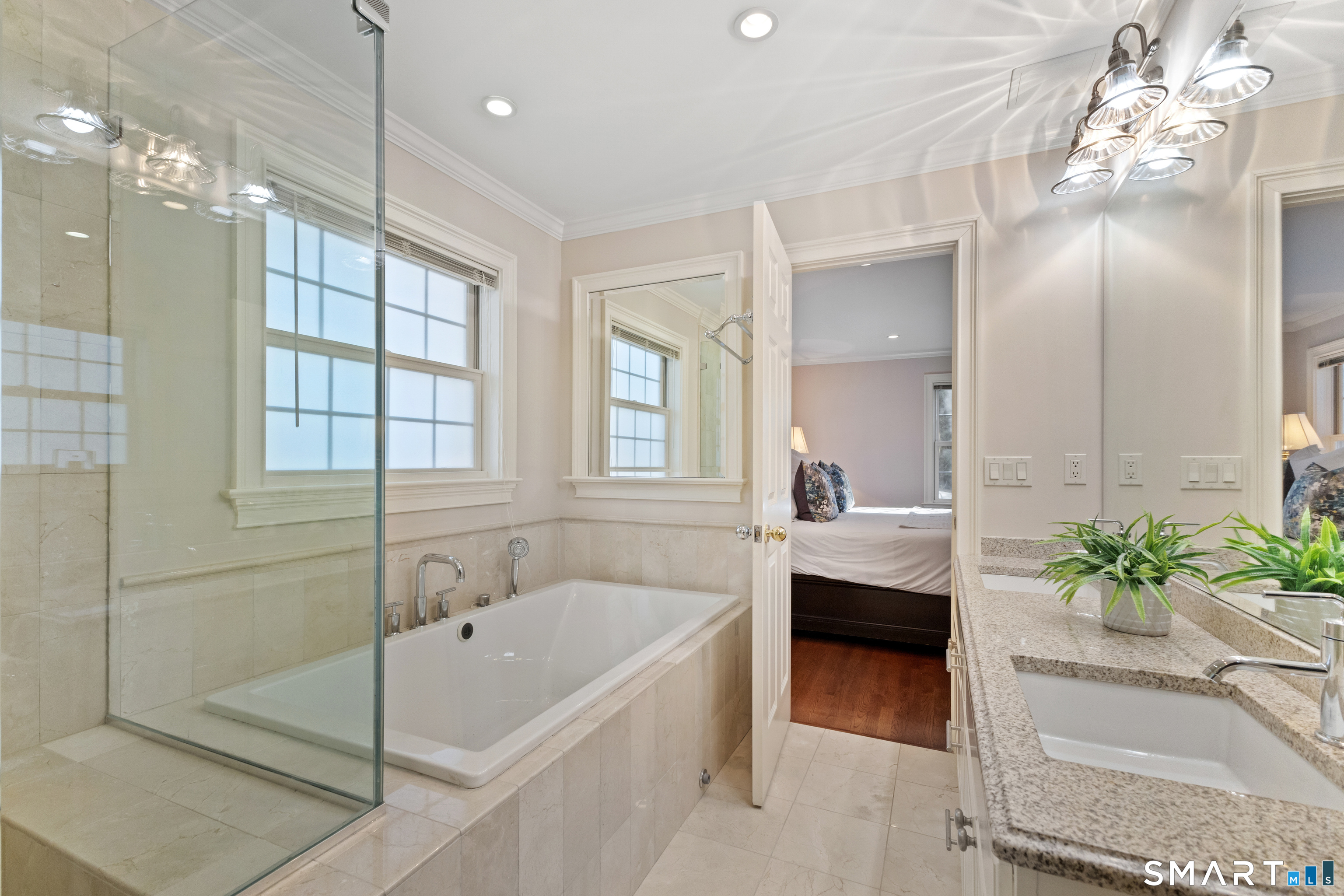 61 Hobson Street Stamford, CT 06902 - Photo 26 of 36 a bathroom with a tub sink and glass door shower