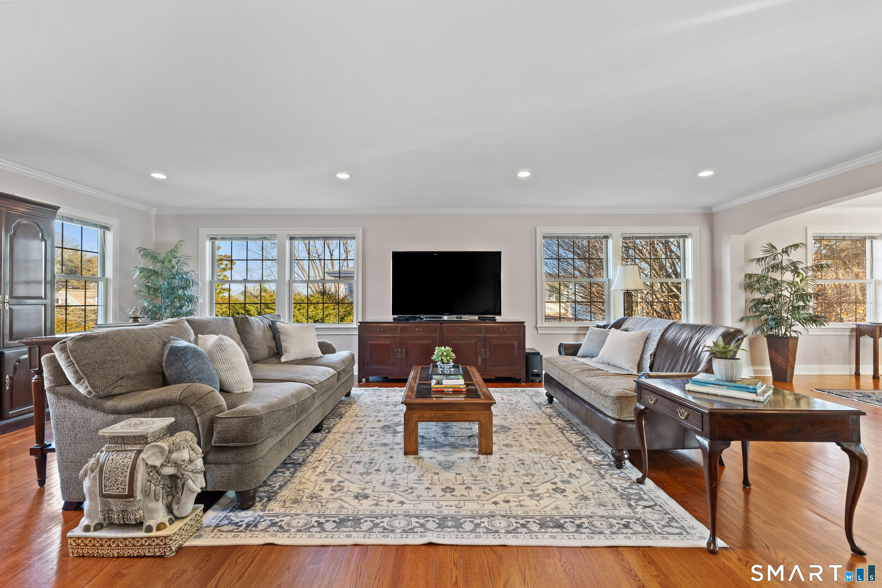 61 Hobson Street Stamford, CT 06902 - Photo 5 of 36 a living room with furniture and a flat screen tv