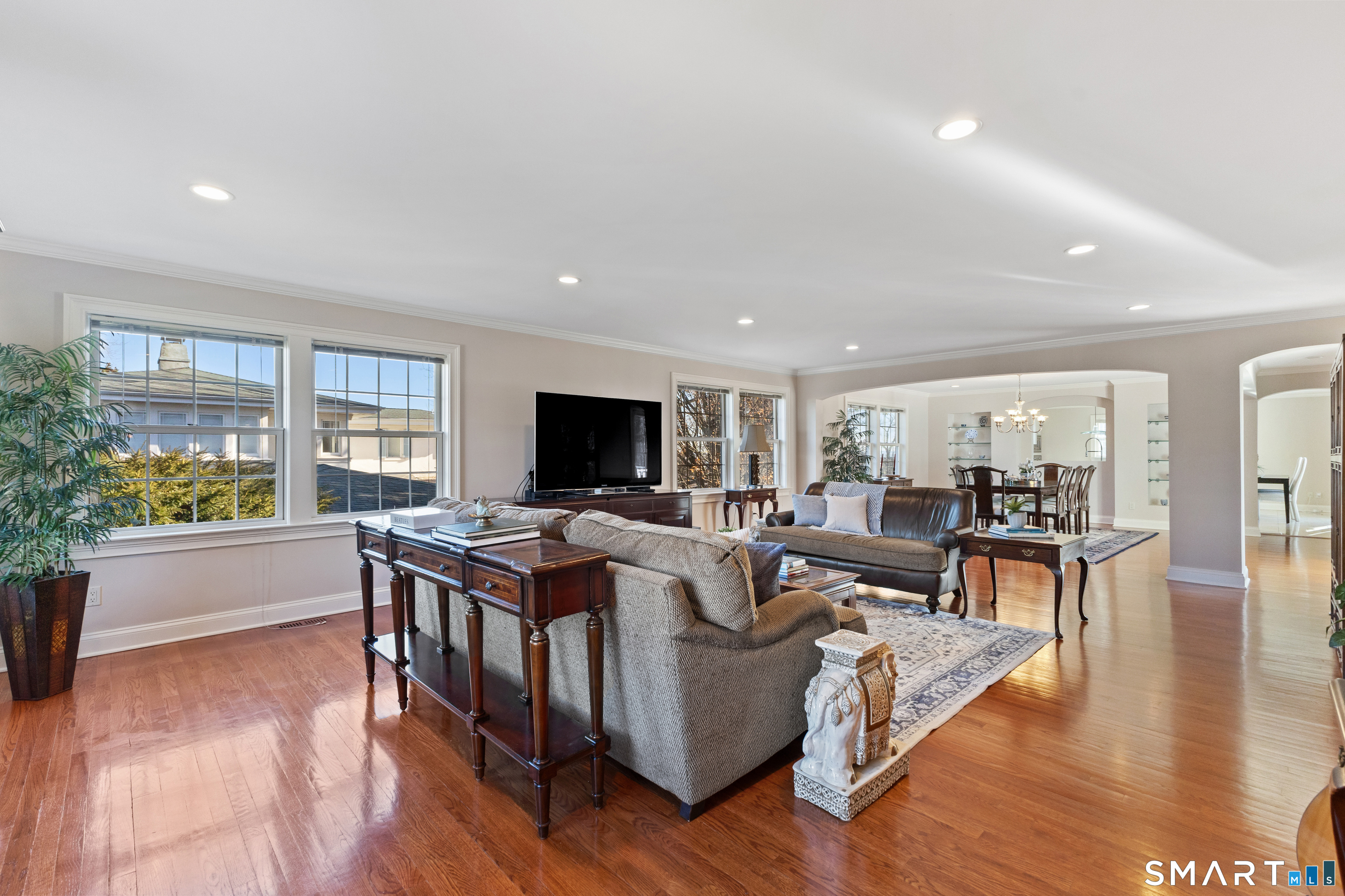 61 Hobson Street Stamford, CT 06902 - Photo 8 of 36 a living room with furniture a flat screen tv and a large window