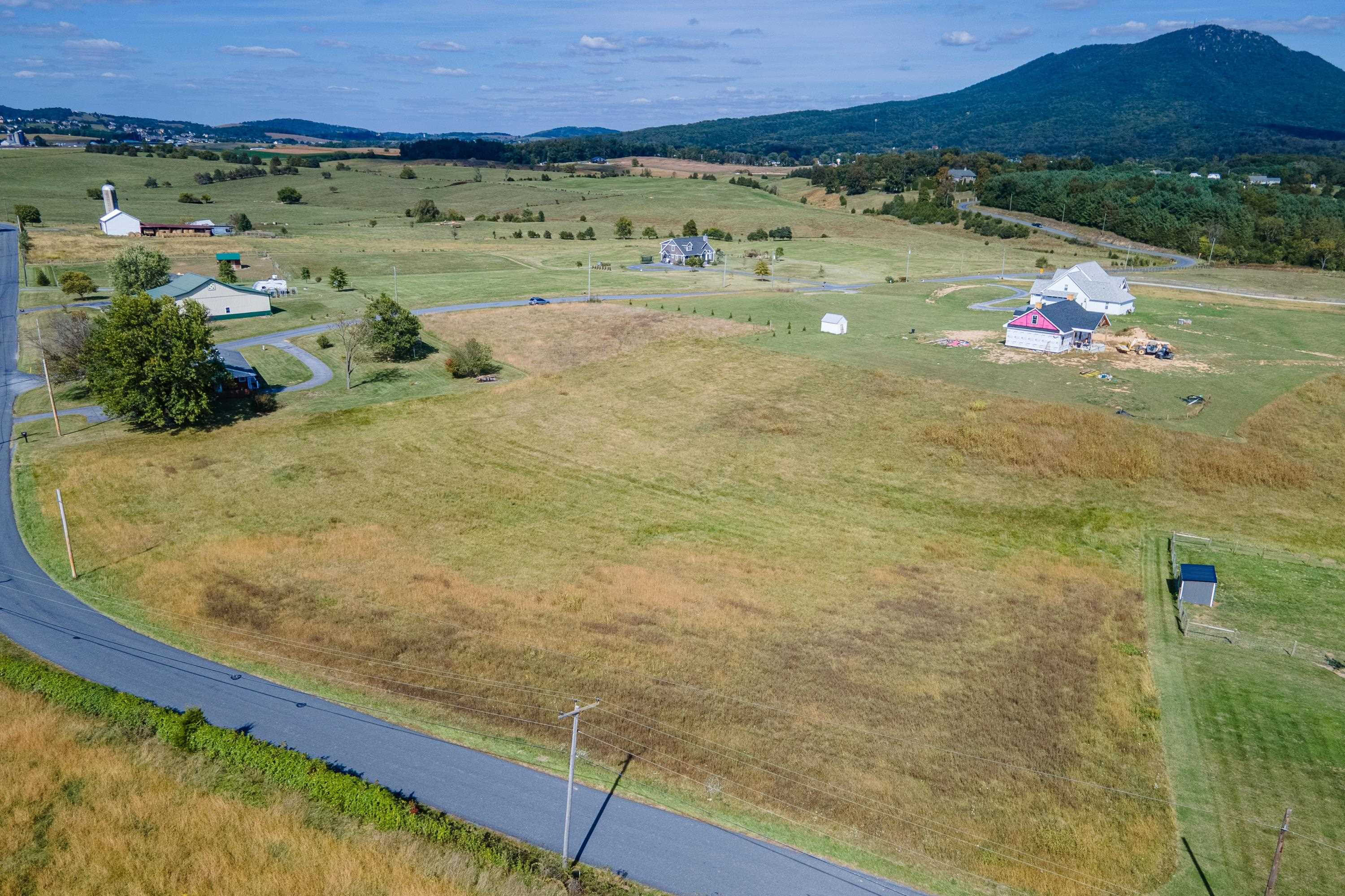 6165 Oak Shade Road Penn Laird, VA 22846 - Photo 11 of 20 a view of a pool with a table and chairs