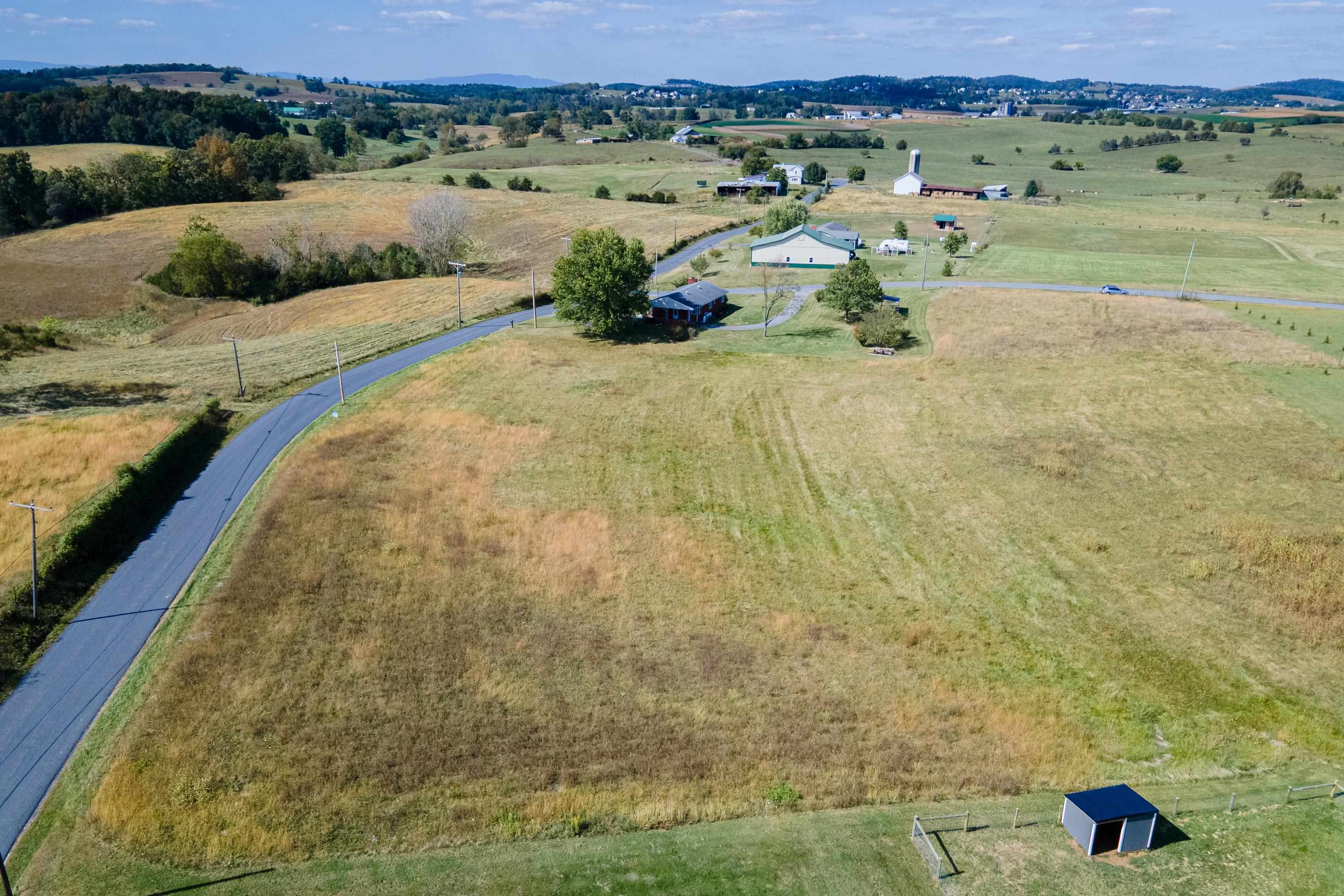 6165 Oak Shade Road Penn Laird, VA 22846 - Photo 12 of 20 a view of a lake with a yard