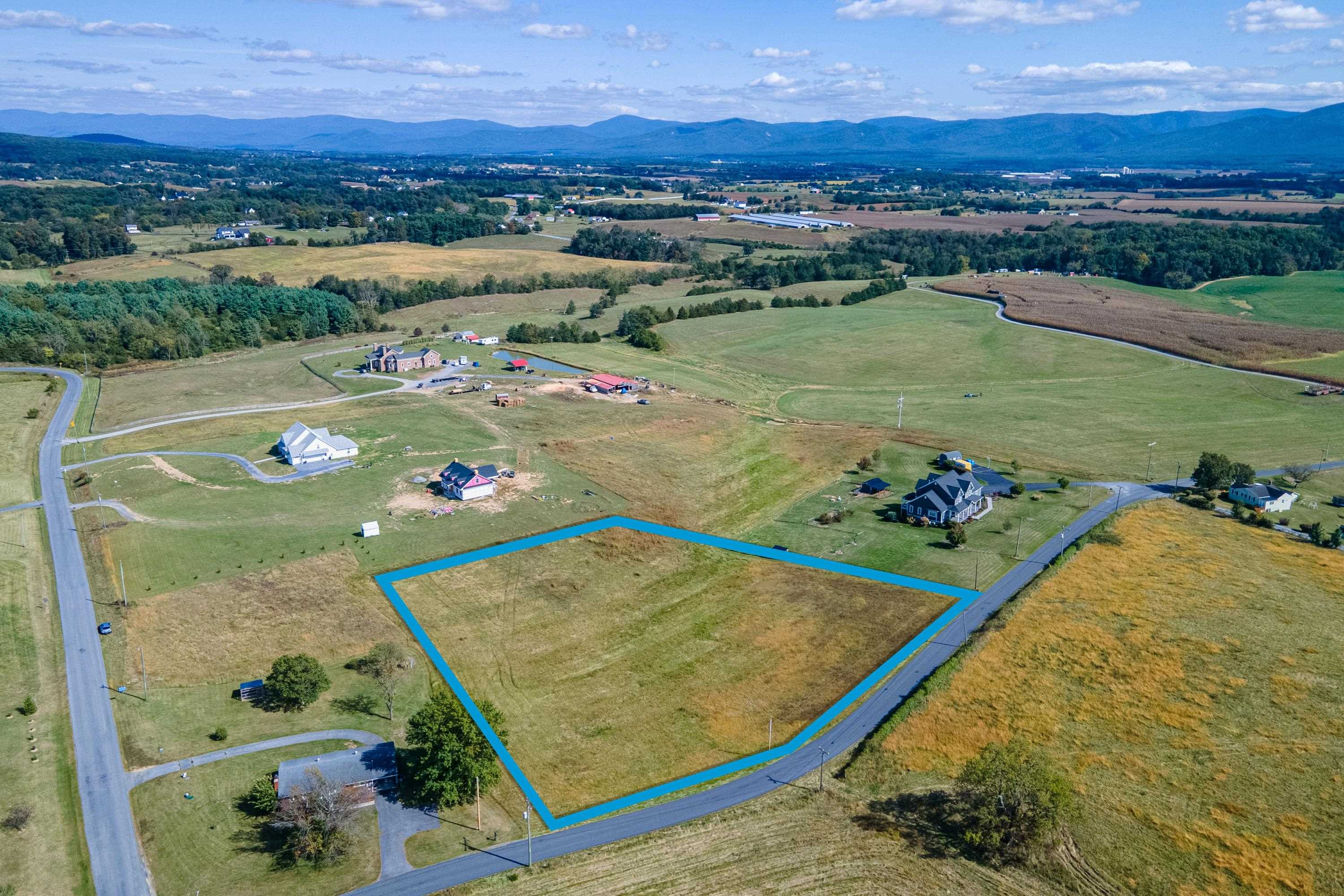 6165 Oak Shade Road Penn Laird, VA 22846 - Photo 8 of 20 an aerial view of a pool patio and mountain view