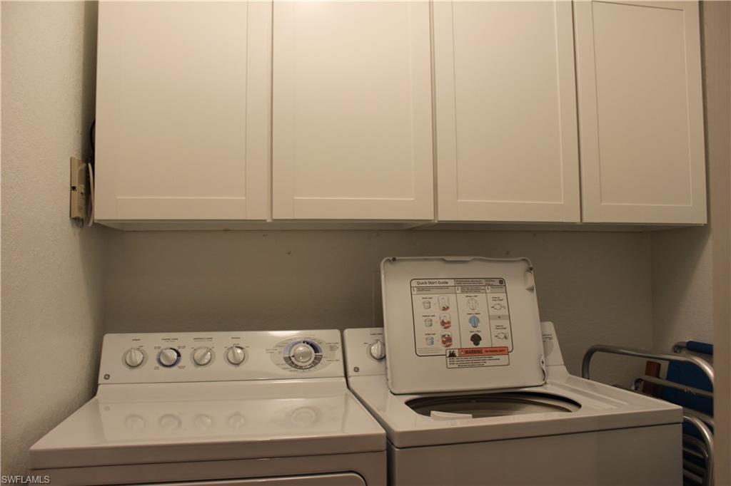 12940 Positano Circle, Unit 204 Naples, FL 34105 - Photo 21 of 39 a utility room with dryer and washer
