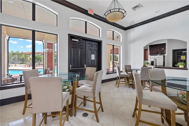 a view of a dining room with furniture window and outside view
