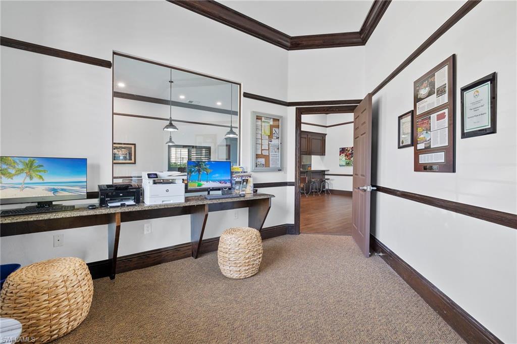 12940 Positano Circle, Unit 204 Naples, FL 34105 - Photo 30 of 39 a kitchen with stainless steel appliances granite countertop a sink and cabinets
