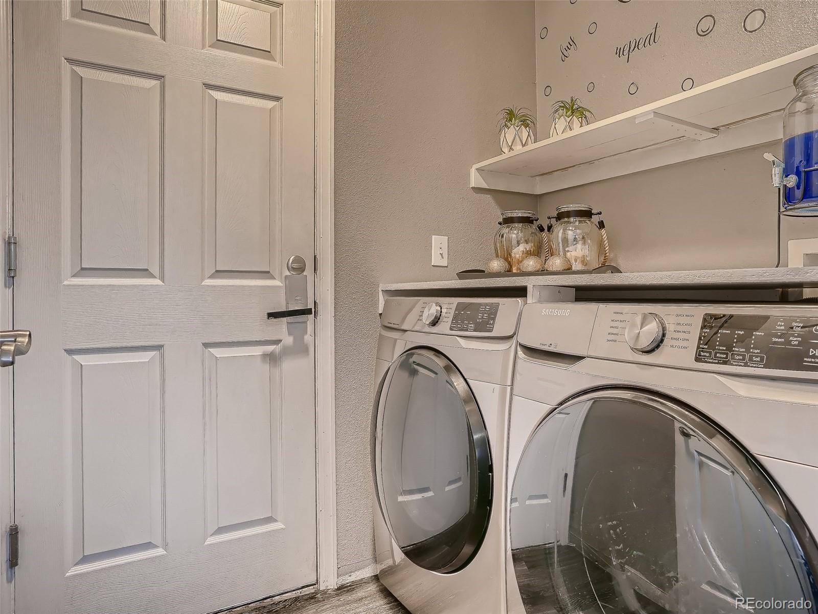 10047 Crystal Circle Commerce City, CO 80022 - Photo 23 of 28 a utility room with dryer and washer