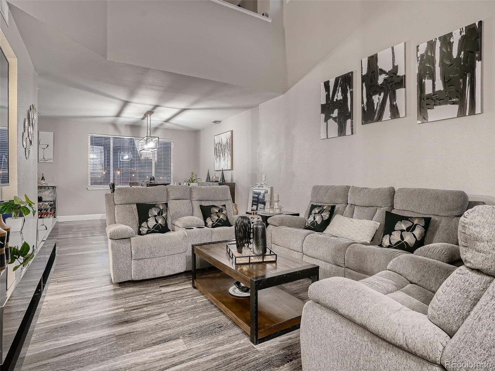10047 Crystal Circle Commerce City, CO 80022 - Photo 4 of 28 a living room with furniture