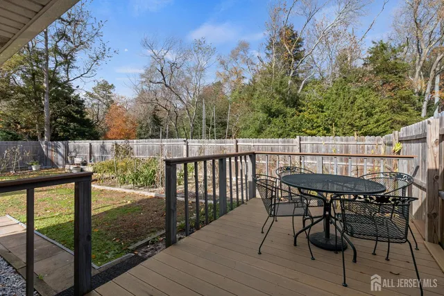 a view of a chair and table on the wooden floor