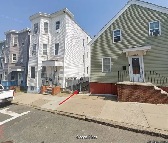 a front view of a house with chairs