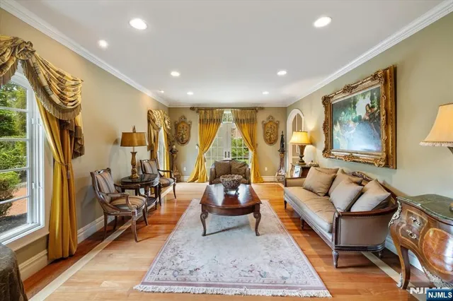 a large kitchen with stainless steel appliances granite countertop a refrigerator and a stove top oven