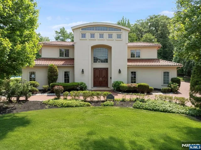 a front view of house with yard and outdoor seating