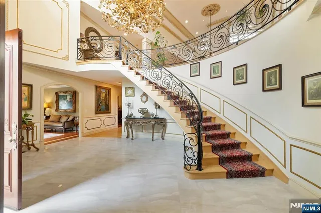a view of entryway and hall with stairs