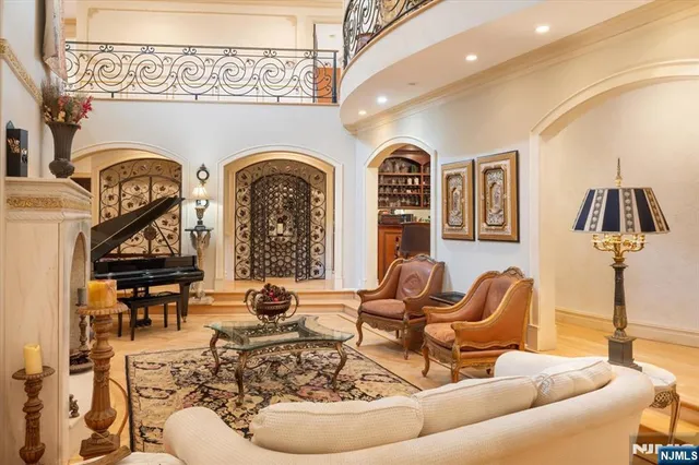 a view of a dining room with furniture a chandelier and wooden floor