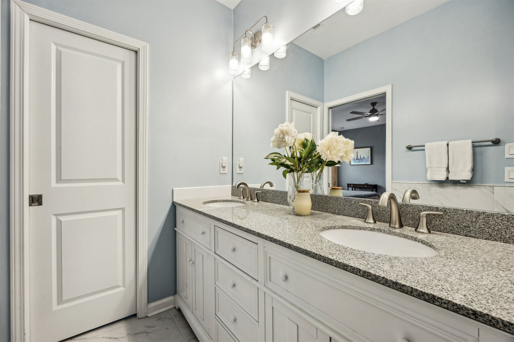 307 Elm Street Fernandina Beach, FL 32034 - Photo 18 of 35 a bathroom with a granite countertop double vanity and a mirror
