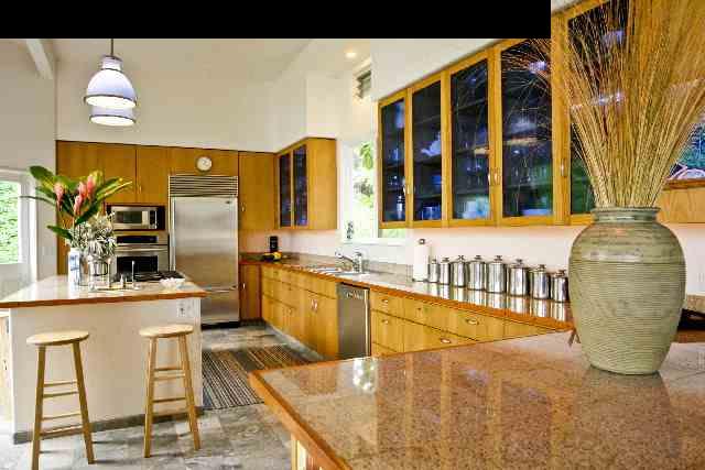 160 Door Of Faith Road Haiku, HI 96708 - Photo 9 of 21 a dining hall with stainless steel appliances kitchen island granite countertop a table and chairs