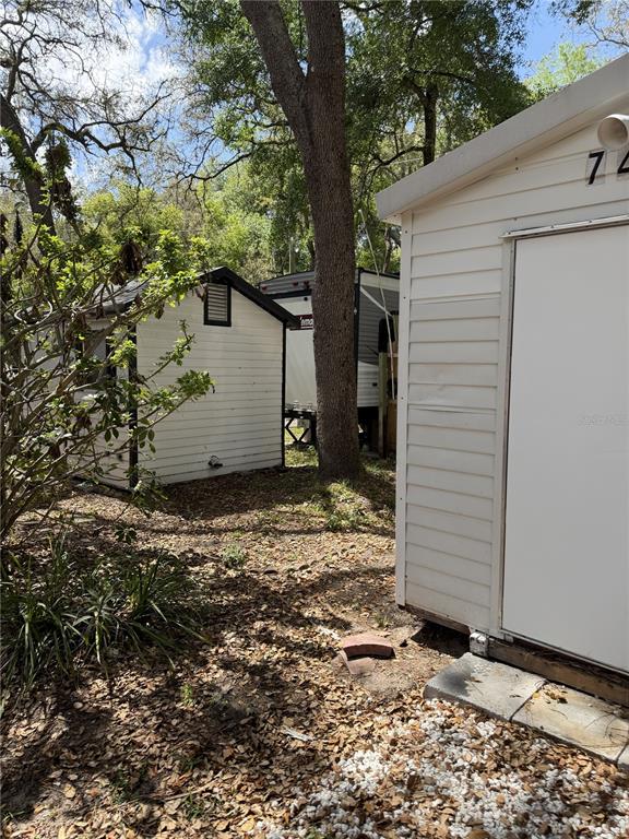 3000 Clarcona Road, Unit 743 Apopka, FL 32703 - Photo 11 of 54 a view of a house with a yard