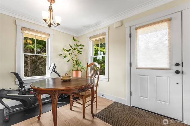 a view of a dining room with furniture window and outside view