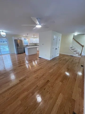 a view of a livingroom with furniture and wooden floor