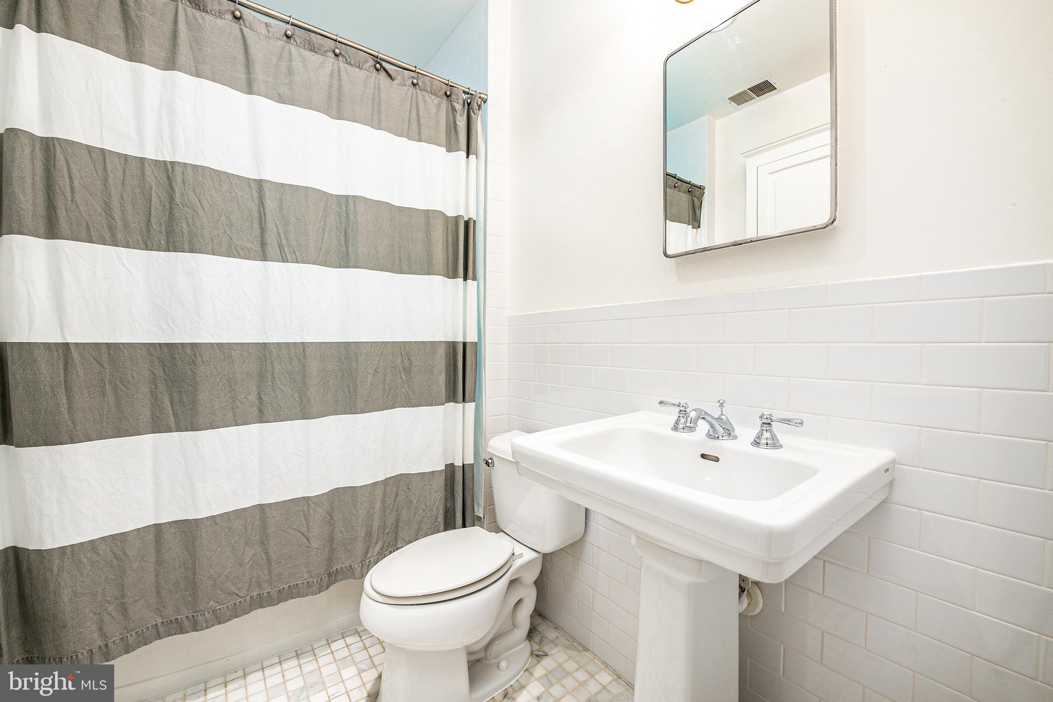 3806 Military Road Northwest Washington, DC 20015 - Photo 30 of 50 Second level renovated hall bath with tub
