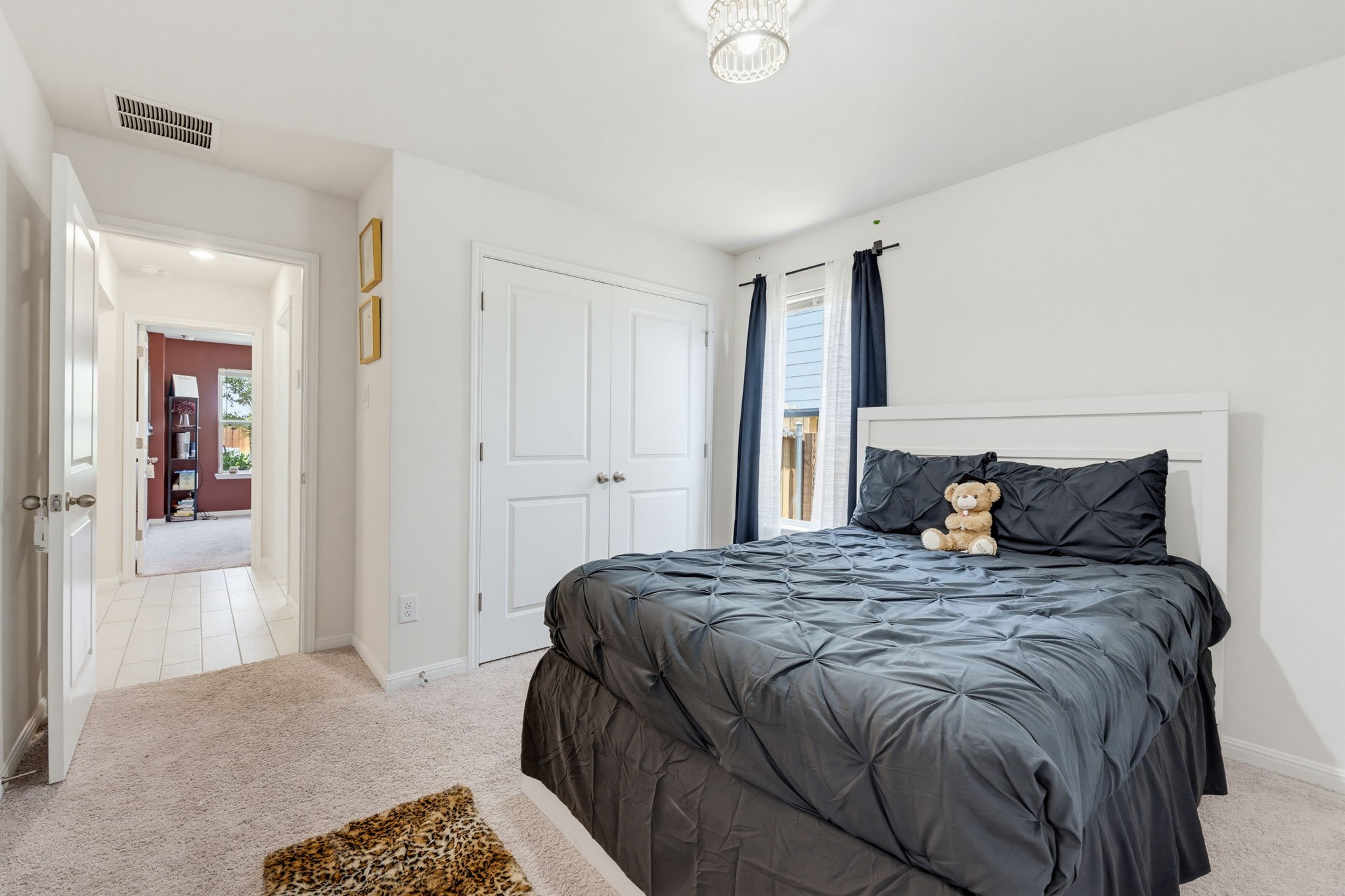 316 Windstar Road Liberty Hill, TX 78642 - Photo 22 of 27 a bedroom with a bed and walk in closet