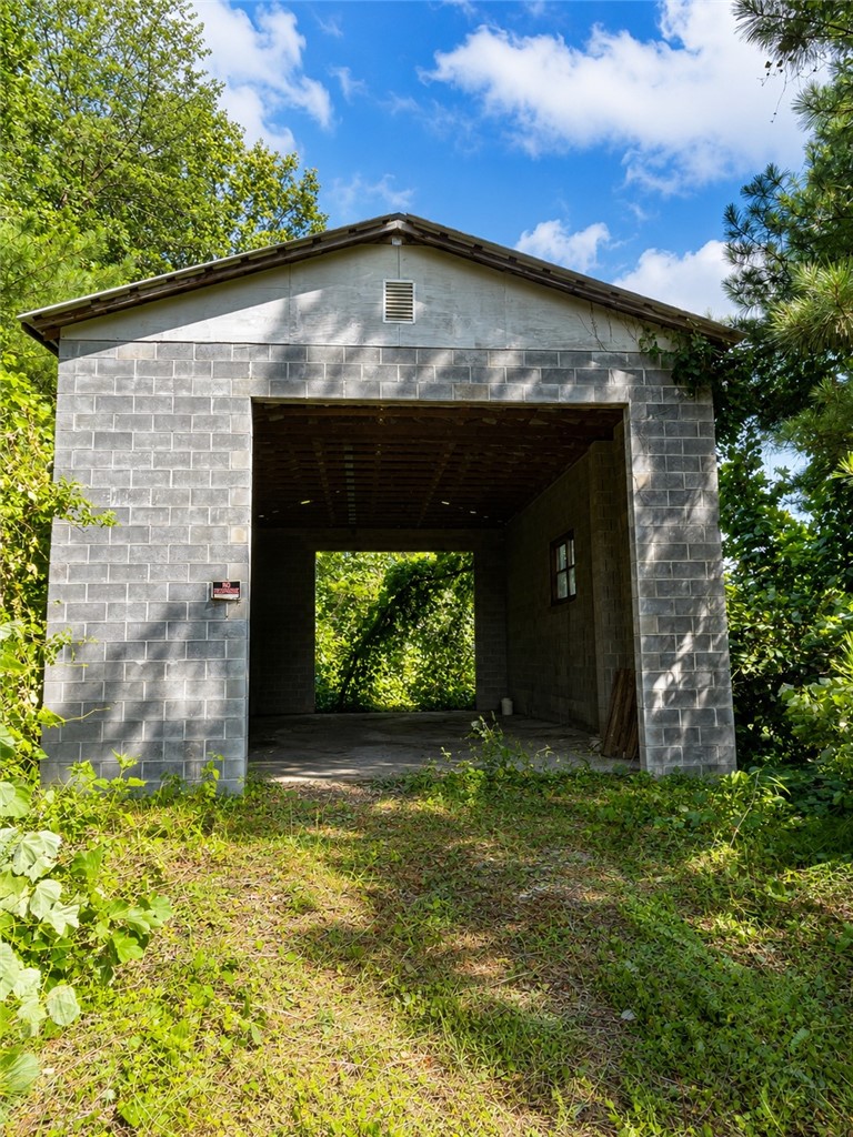 597 Old Hurricane Road Westminster, SC 29693 - Photo 10 of 11 A detached two-car garage crafted from robust concrete block, offering ample storage potential.