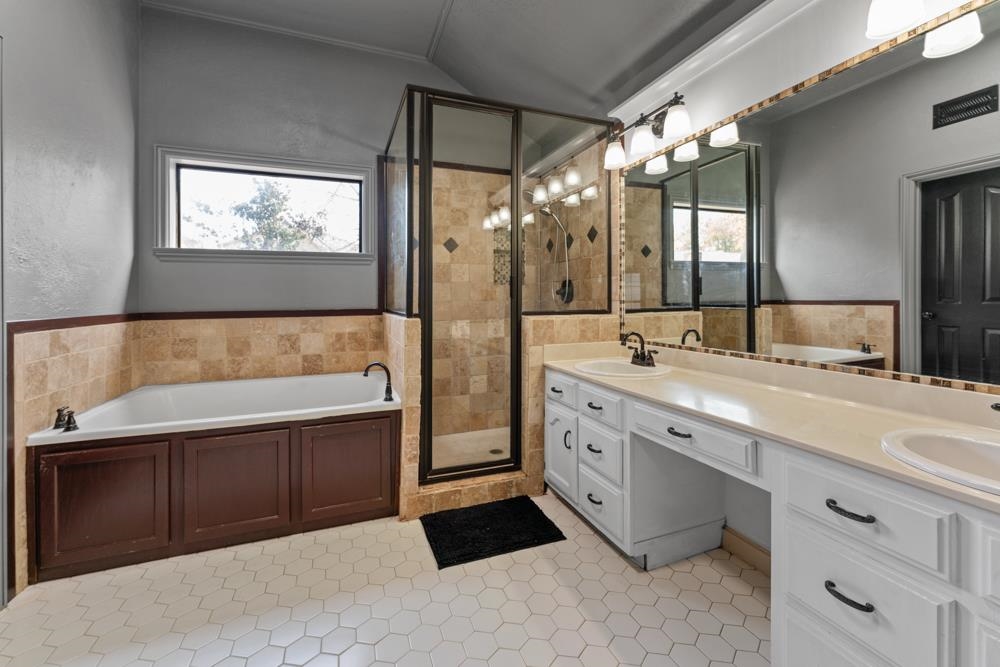 3358 Altruria Road Bartlett, TN 38135 - Photo 17 of 28 a spacious bathroom with a tub sink and mirror